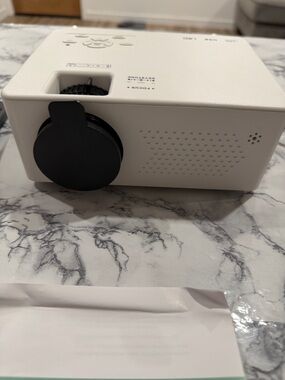 Compact White Mini Projector with Black Lens Cap